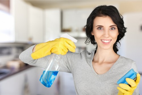 Technician inspecting a carpet for stains and treatment requirements
