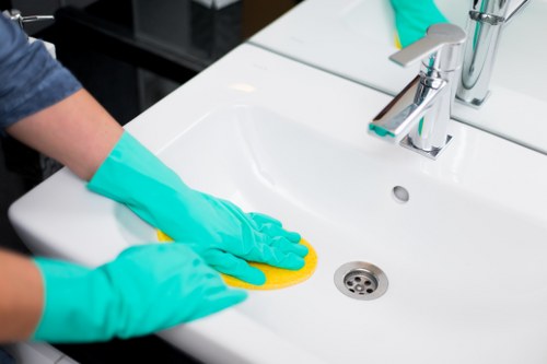 Professional carpet cleaner managing wet floors safely