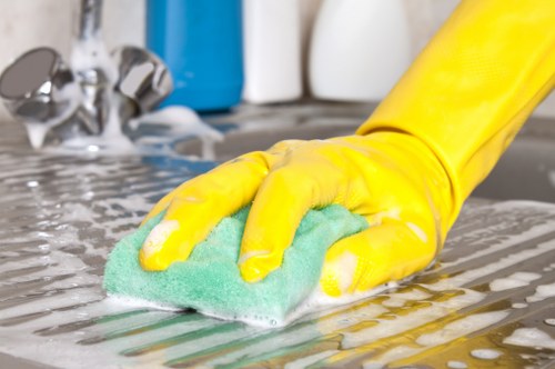 Local oven cleaner working in a Hackney apartment kitchen