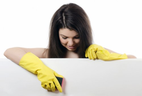 Local cleaner treating fabric furniture in a Hackney home