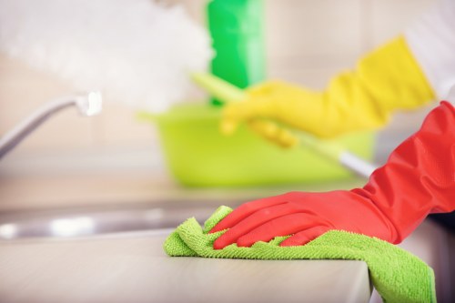 Local house cleaner working in a Hackney property with varied room layouts